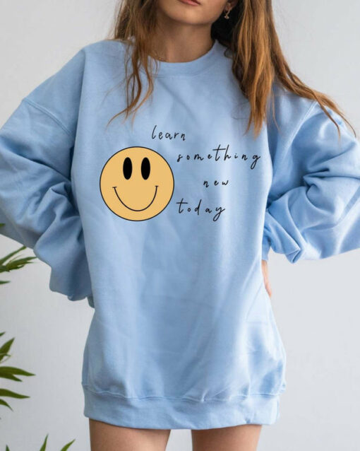 blue smiley face sweatshirt